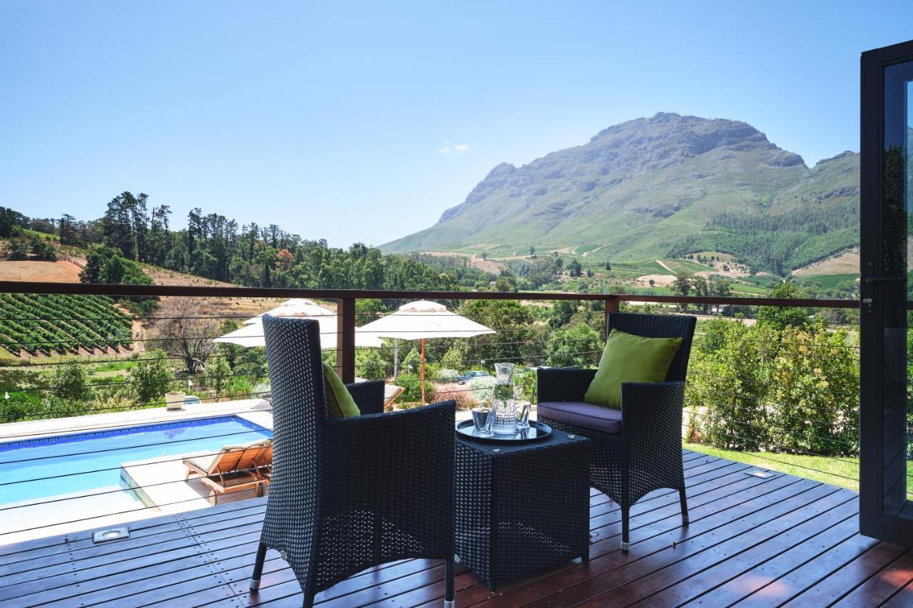 Alluvia Boutique Winery & Luxury Accommodation Stellenbosch Exterior foto View of the Hottentots-Holland Mountains from the Cape Winelands
